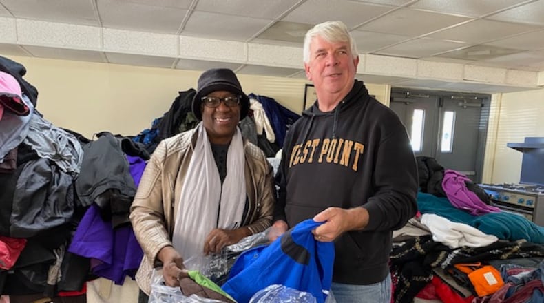 Cherokee County Homeless Veterans Program founder Jim Lindenmayer helps pack the thousands of new and gently used coats donated to the program. The coats are given away to homeless veterans and to local schools. (Courtesy of Jim Lindenmayer)