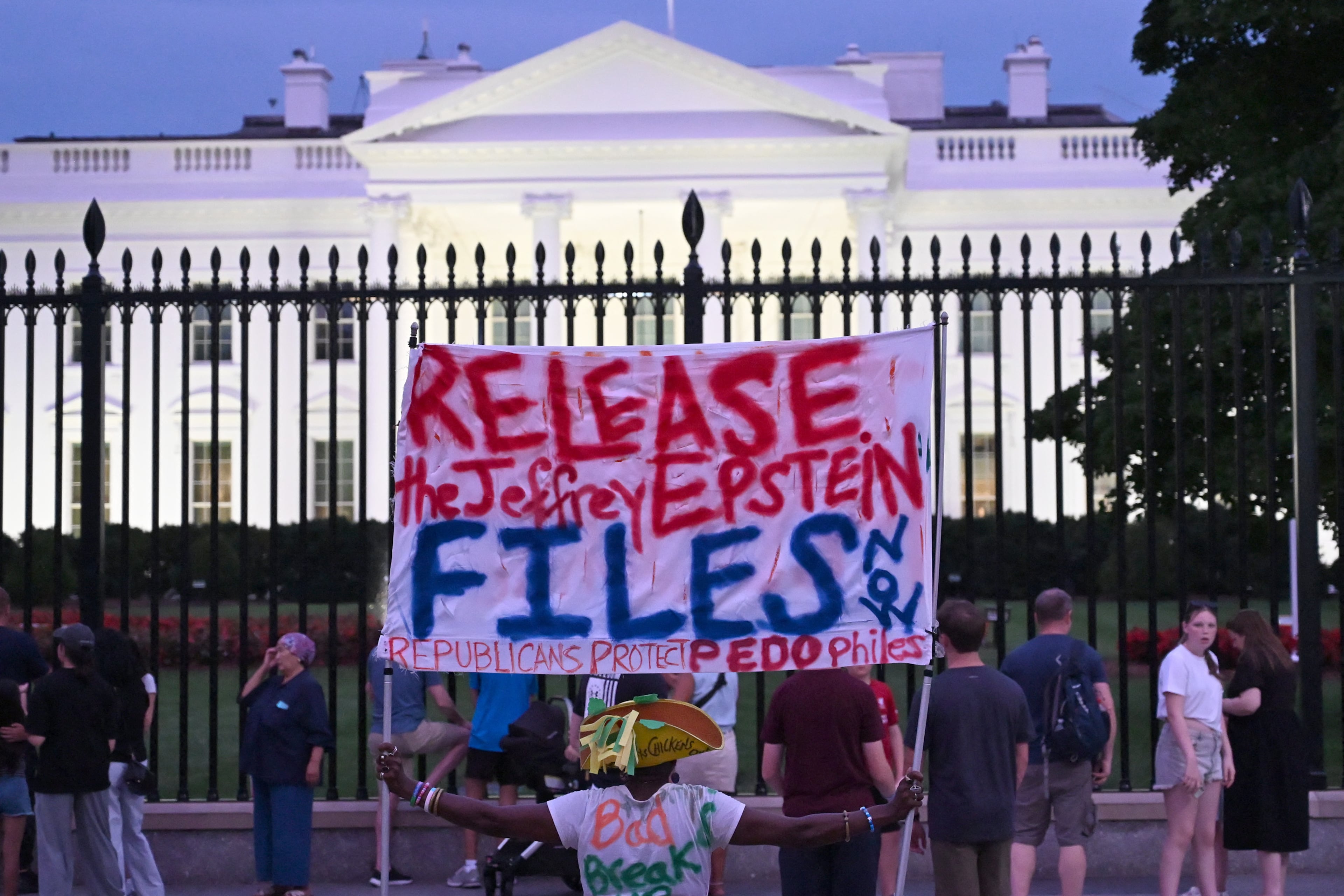 A demonstrator held a sign outside the White House earlier this month that demanded the release to all files related to Jeffrey Epstein.