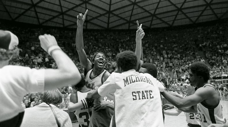 Michigan State's Earvin (Magic) Johnson raises his finger to indicate the Spartans are number one after defeating Larry Bird's Indiana State team 75-64 to win the NCAA Championship March 26, 1979, in Salt Lake City.
