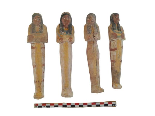 In this undated photo, artifacts are displayed that were found in the three new graves of senior statesmen found in the Dra' Abu al-Naga necropolis area in Luxor, Egypt. (Egypt Ministry of Tourism and Antiquities via AP)