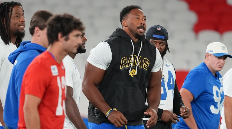 Los Angeles Rams outside linebacker Myles Garrett, centre, works out during a practice session for an NFL football game against the San Francisco 49ers., in Melbourne, Australia, Thursday, Sept. 10, 2026.(AP Photo/Asanka Brendon Ratnayake)