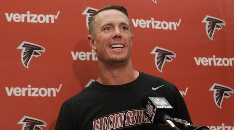 Falcons quarterback Matt Ryan, who was all smiles after Sunday's win, has thrown for 730 yards and leads the NFL in quarterback efficiency rating. (AP photo)