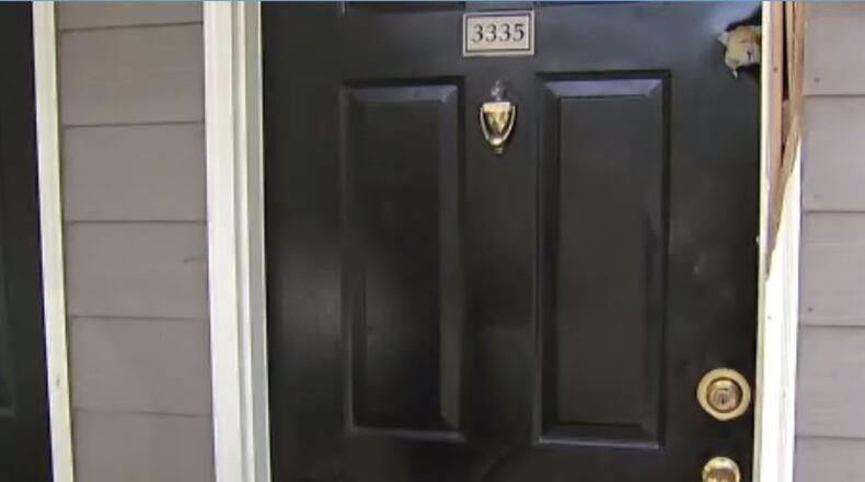 A suspected robber was shot and killed outside a DeKalb County apartment complex, police said. (Credit: Channel 2 Action News)
