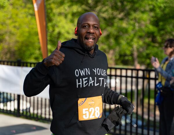 Thomas Chambless crosses the finish line. Over 800 people gathered and ran Sunday morning for the Daffodil Dash in honor of the 1.5 million children who died in the Holocaust. Sunday, April 7th, 2024 (Ben Hendren for the Atlanta Journal Constituion)