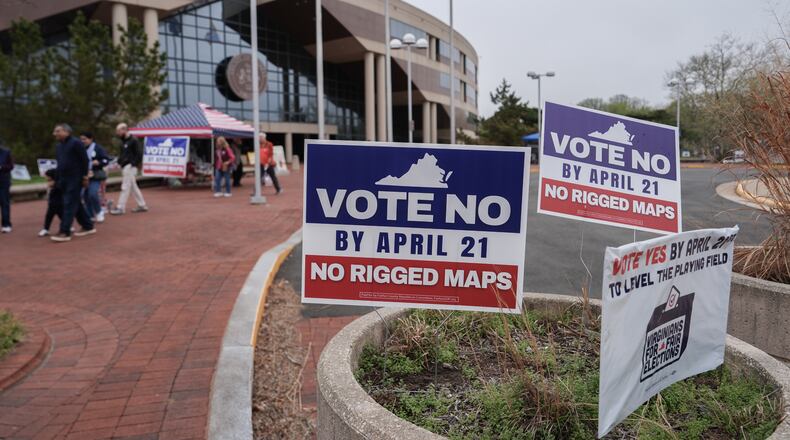 Voters walk outside the Fairfax County Government Center during early voting for the Virginia redistricting referendum, Friday, April 3, 2026, in Fairfax, Va. (AP Photo/Julia Demaree Nikhinson)
