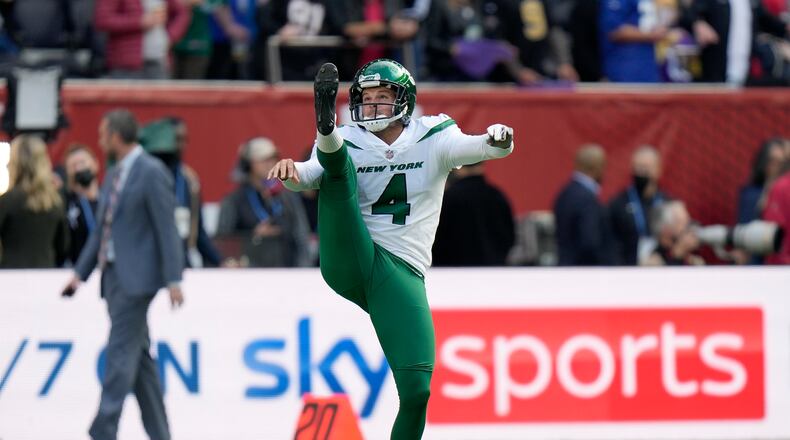 New York Jets punter Thomas Morstead (4) kicks the ball during the warm-up before an NFL football game between the New York Jets and the Atlanta Falcons at the Tottenham Hotspur stadium in London, England, Sunday, Oct. 10, 2021. (AP Photo/Alastair Grant)