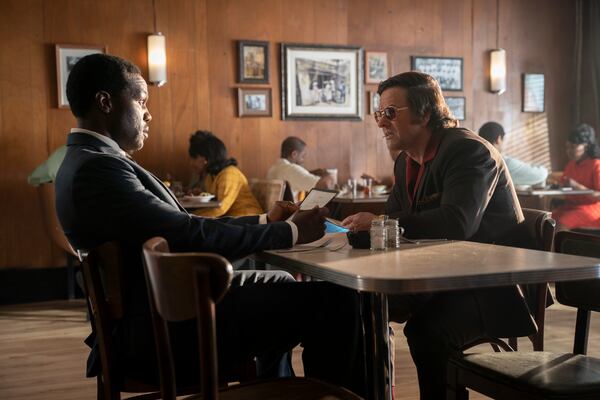 Yahya Abdul-Mateen II, left, and Mark Wahlberg star in Paramount Pictures' "By Any Means." They are in a Town House Cafe in Covington for this particular scene. (Courtesy of Paramount Pictures)