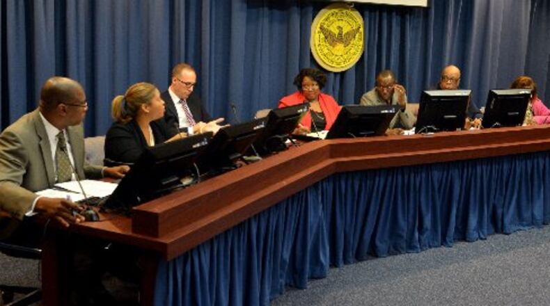 Jim Beard, Atlanta’s chief financial officer and member of the three city pension boards, listens to Atlanta Human Resources commissioner Yvonne Yancy at a meeting of the city’s general employees’ pension board. KENT D. JOHNSON / AJC File Photo
