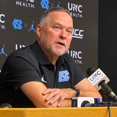 In this photo taken with a smartphone, North Carolina men's basketball head coach Michael Malone speaks during a news conference Thursday, Sept. 3, 2026, in Chapel Hill, N.C. (AP Photo/Aaron Beard)
