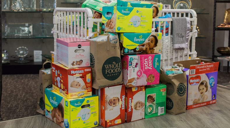 Local residents donated more than 3,500 diapers to local moms in response to a call to help from Brooke Henze, founder of the nonprofit Foster Swell Inc. Henze also raised more than $1,000 to help purchase diapers for babies of Syrian refugees. CONTRIBUTED BY STEPHANIE MADISON PHOTOGRAPHY