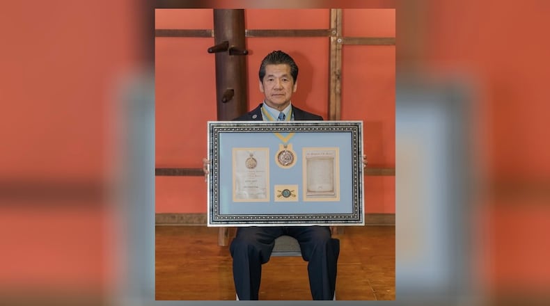 The National Infantry Association presented The Order of Saint Maurice Award medallion for civilians to Francis Fong, 73, on Saturday at his martial arts school. Courtesy Tracey Fong