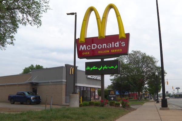 In this image made from video, a McDonald's restaurant's digital board features a message in Arabic Monday, June 9, 2025, in Dearborn, Mich. (AP Photo/Mike Householder)