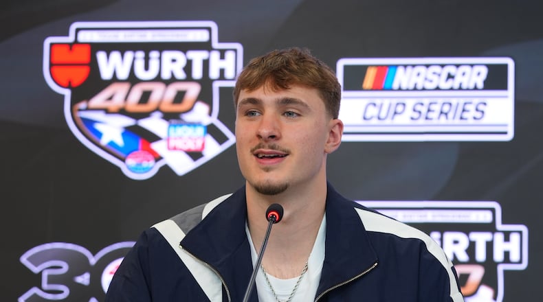Dallas Mavericks forward Cooper Flagg answers a question before acting as honorary pace car driver for a NASCAR Cup Series auto race at Texas Motor Speedway in Fort Worth, Texas, Sunday, May 3, 2026. (AP Photo/LM Otero)