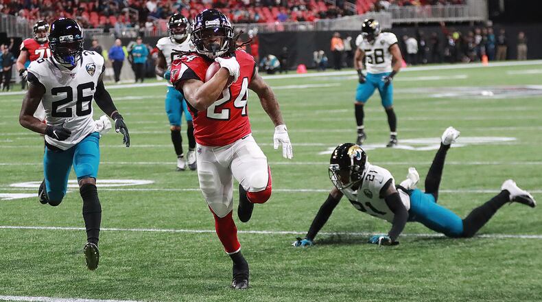 Atlanta Falcons running back Devonta Freeman breaks free for a touchdown run on the opening drive against the Jacksonville Jaguars Sunday, Dec. 22, 2019, at Mercedes-Benz Stadium in Atlanta.