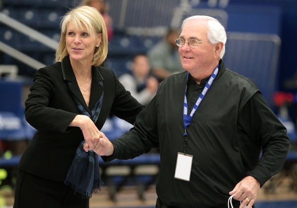 In this file photo, former Georgia State University Athletic Director Cheryl Levick, left, greets former GSU coach Bob Reinhart during half time of GSU's game against Northeastern game at the Sports Arena Saturday afternoon in Atlanta, Ga., Feb. 12, 2011. GSU honored the team and coaches for their 10th and 20th anniversary NCAA tourney teams. Reinhart coached GSU in the 1990-91 NCAA Tournament. (Jason Getz/AJC)