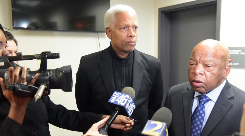 U. S. Congressmen Hank Johnson (D-Lithonia, left) and John Lewis (D-Atlanta) talk with the media following a meeting at Hartsfield Jackson International airport on Jan. 25, 2017. Kent D. Johnson/AJC