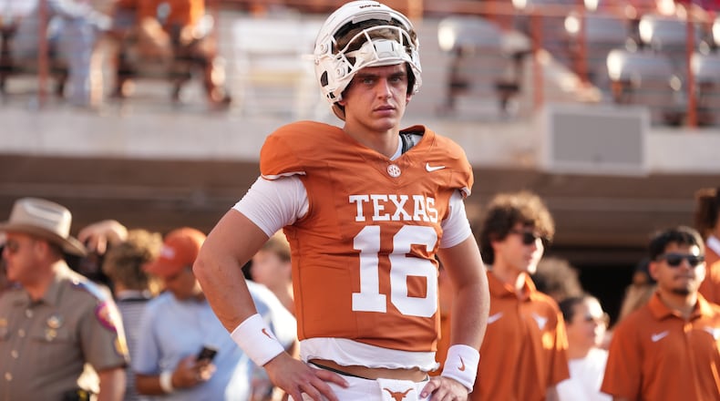 Texas quarterback Arch Manning (16) warms up before an NCAA college football game against Ohio State in Austin, Texas, Saturday, Sept. 12, 2026. (AP Photo/Eric Gay)