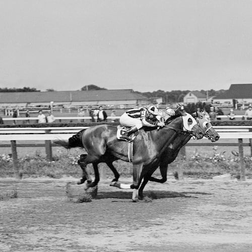FILE - Seabiscuit leads local horse Aneroid by a nose in the Brooklyn Handicap at the Aqueduct race track in New York on June 26, 1937. (AP Photo/Joe Caneva, File)