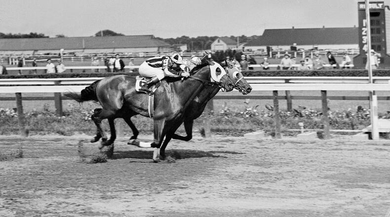 FILE - Seabiscuit leads local horse Aneroid by a nose in the Brooklyn Handicap at the Aqueduct race track in New York on June 26, 1937. (AP Photo/Joe Caneva, File)