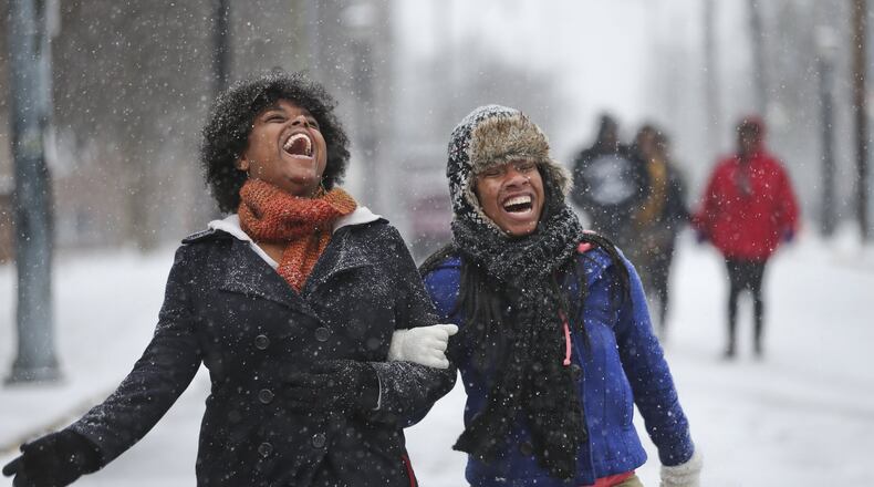 Clark Atlanta University students, Tamara Lawson-21, junior (left) and Ebony Killebrew-21,junior skip down James P. Brawley Drive on campus. JOHN SPINK/JSPINK@AJC.COM AJC File Photo