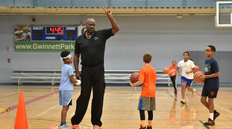Coach Rodney Zimmerman uses his hand as a tool of discipline instead of using a whistle at Lucky Shoals Park’s Community Recreation Center in Norcross on Friday, December 27, 2019. The Gwinnett County program that teaches basketball skills, but goes beyond the physical. (Hyosub Shin / Hyosub.Shin@ajc.com)