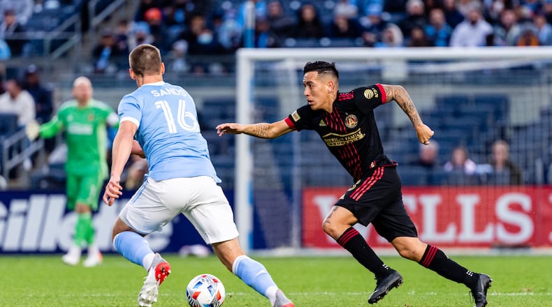 Atlanta United midfielder Ezequiel Barco #8 dribbles during the round one playoff match against New York City FC at Yankee Stadium in Bronx, New York on Sunday November 21, 2021. (Photo by Dakota Williams/Atlanta United)