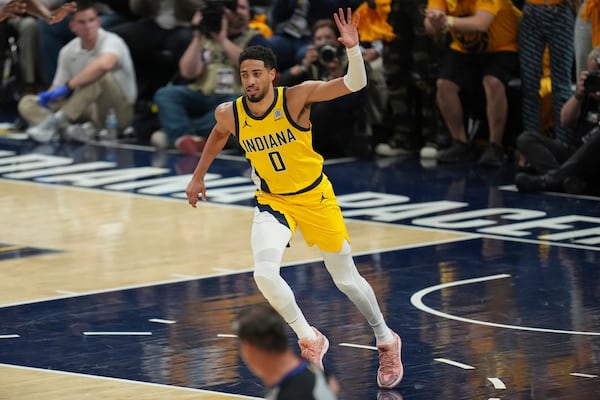 Indiana Pacers guard Tyrese Haliburton celebrates a basket against the Oklahoma City Thunder during the first half of Game 6 of the NBA Finals basketball series, Thursday, June 19, 2025, in Indianapolis. (AP Photo/Michael Conroy)