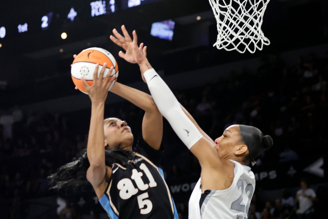 Dream All-Star Angel Reese (left) shoots against Aces center A’ja Wilson on Tuesday, Aug. 18, 2026, in Las Vegas. Reese made it hard for Wilson to get to her sweet spots with the ball, AJC columnist Michael Cunningham writes. (Steve Marcus/Las Vegas Sun via AP)