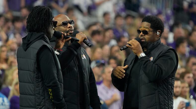 Boyz II Men sing the national anthem prior to the Fiesta Bowl NCAA college football semifinal playoff game between TCU and Michigan, Saturday, Dec. 31, 2022, in Glendale, Ariz. (AP Photo/Rick Scuteri)