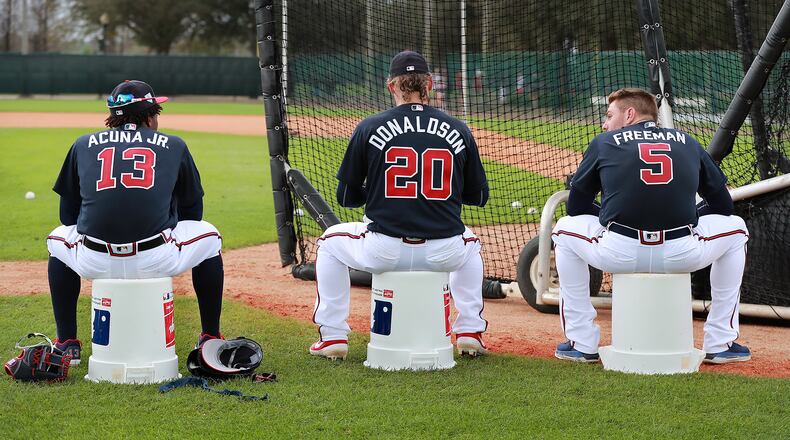 Braves players Ronald Acuna (from left), Josh Donaldson, and Freddie Freeman wait their turn to bat during the first full squad workout Thursday, Feb. 21, 2019, in Lake Buena Vista, Fla.