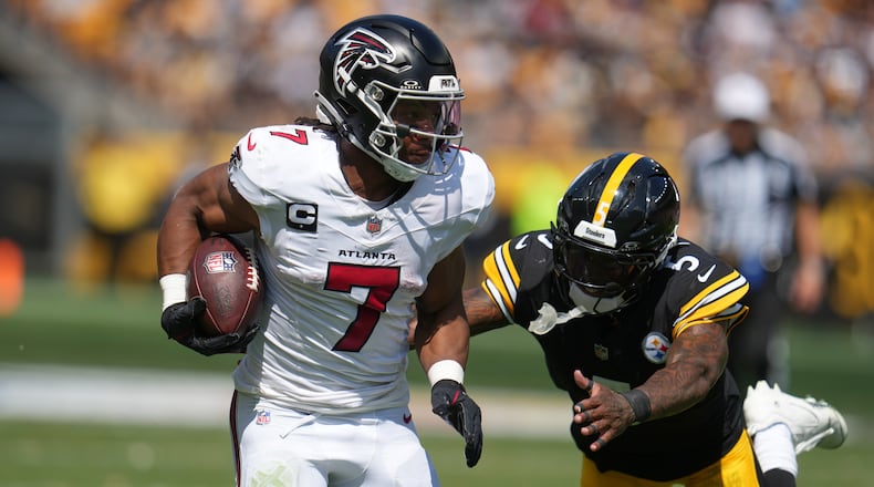 Falcons running back Bijan Robinson runs for a touchdown against the Steelers on Sunday, Sept. 13, 2026 in Pittsburgh. The Falcons took a 20-13 loss. (Gene J. Puskar/AP)