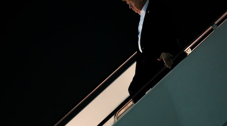 President Donald Trump disembarks Air Force One after attending the G7 summit in France, Thursday, June 18, 2026, at Joint Base Andrews, Md. (AP Photo/Julia Demaree Nikhinson)