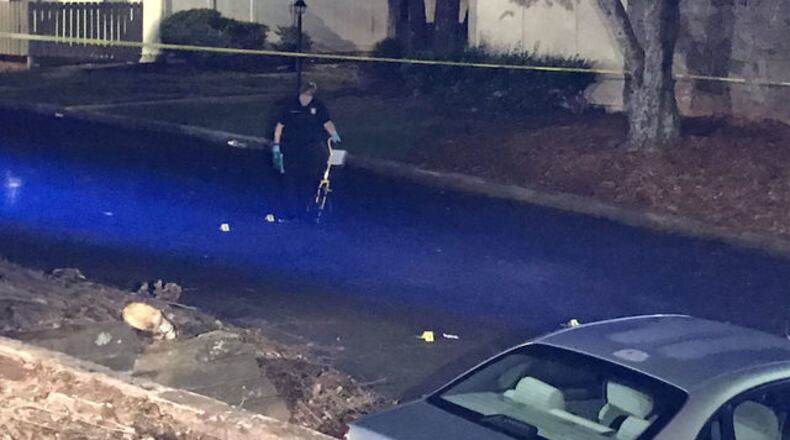 Police are investigating a deadly shooting outside a DeKalb County apartment. (Credit: Channel 2 Action News)