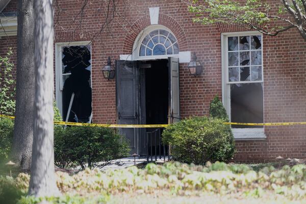 The windows and door is damaged from an overnight fire at the governor’s official residence on Sunday, April 13, 2025 in Harrisburg, Pa. (AP Photo/Marc Levy)