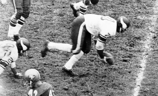 FILE - Minnesota Vikings defensive end Jim Marshall (70) scoops up a fumble by the San Francisco 49ers and starts running 60-yards the wrong way run into his own end zone for a safety during the fourth quarter of an NFL football game in San Francisco, Calif., Oct. 26, 1964. (San Francisco Examiner via AP, file)