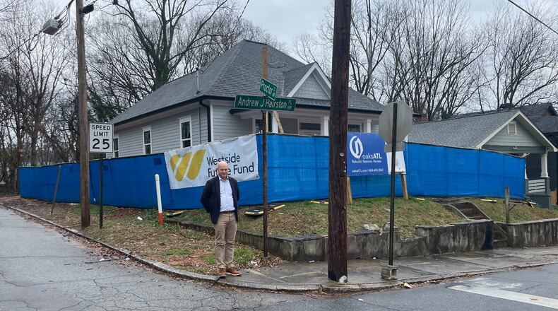 John Ahmann, CEO of the Westside Future Fund, stands outside a property his organization is renovating in the English Avenue neighborhood. (Bill Torpy/AJC)
