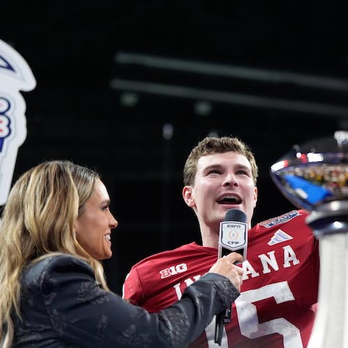 Indiana’s Fernando Mendoza celebrates after the Hoosiers defeated the Oregon Ducks in the Peach Bowl on Friday, Jan. 9, 2026, in Atlanta. Chants of “Heisman-doza” broke out as the quarterback stepped onto the postgame television set. (Brynn Anderson/AP)
