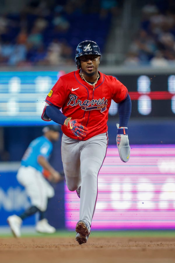 Atlanta Braves' Ozzie Albies advances to third base on a ground out by Michael Harrris II during the second inning of a baseball game against the Miami Marlins, Sunday, June 22, 2025, in Miami. (AP Photo/Chris Arjoon)
