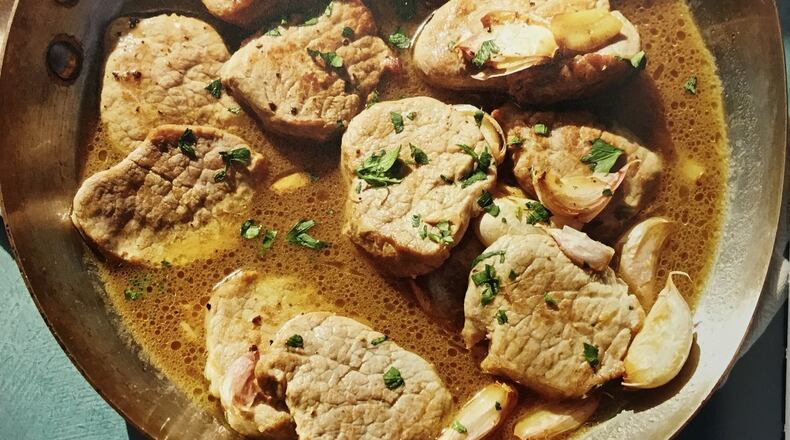These pork fillets are served in a whisky garlic sauce that is popular in Seville, Spain. Contributed by Octopus Publishing Group.