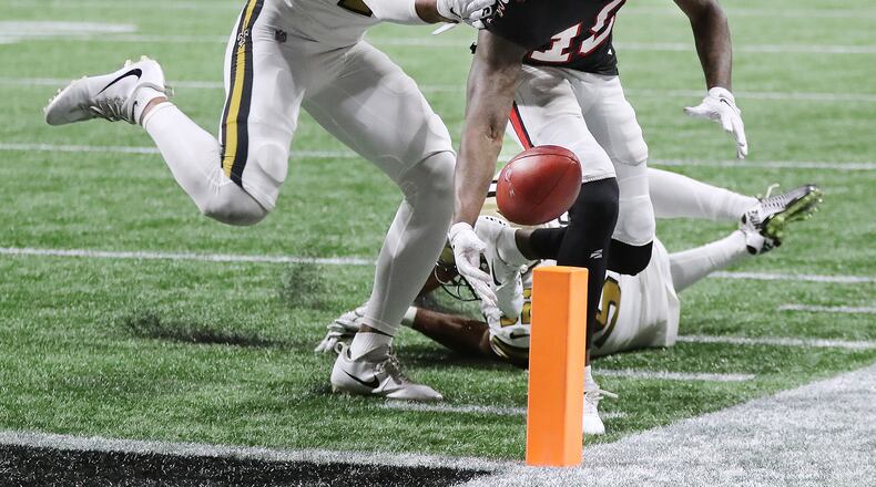 Falcons wide receiver Calvin Ridley drops the ball at the pilon on a 2-point conversion attempt as New Orleans Saints safety Marcus Williams pushes him out of bounds during the fourth quarter in a NFL football game on Thursday, November 28, 2019, in Atlanta. The Saints beat the Falcons 26-18.  Curtis Compton/ccompton@ajc.com