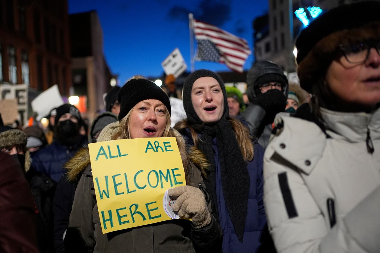 Protesters rally against the presence of U.S. Immigration Customs Enforcement in Maine, Friday, Jan. 23, 2026, in Portland, Maine. (AP Photo/Robert F. Bukaty)