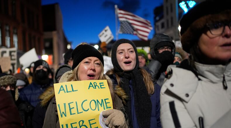 Protesters rally against the presence of U.S. Immigration Customs Enforcement in Maine, Friday, Jan. 23, 2026, in Portland, Maine. (AP Photo/Robert F. Bukaty)