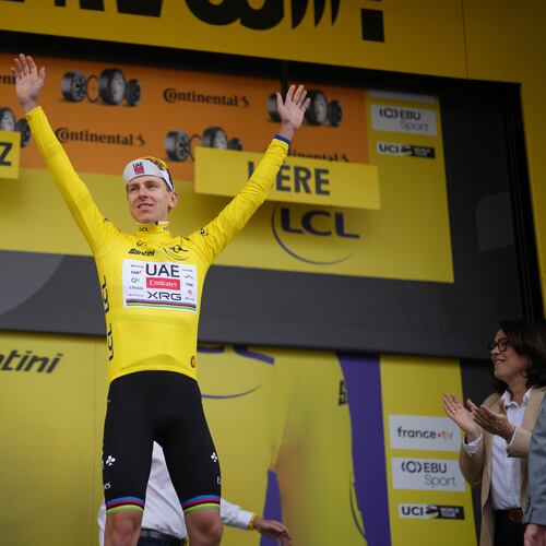 Slovenia's Tadej Pogacar, wearing the overall leader's yellow jersey, celebrates on the podium after the twentieth stage of the Tour de France cycling race with start in Le Bourg d'Oisans and finish in Alpe d'huez, France, Saturday, July 25, 2026. (AP Photo/Thibault Camus)
