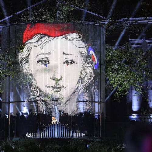 A DJ performs at the "Jardin du 13 novembre 2015" inaugurated Thursday Nov. 13, 2025 in Paris as part of ceremonies marking the 10th anniversary of terrorist attacks that killed 132 people and injured hundreds. (Ludovic Marin, Pool photo via AP)