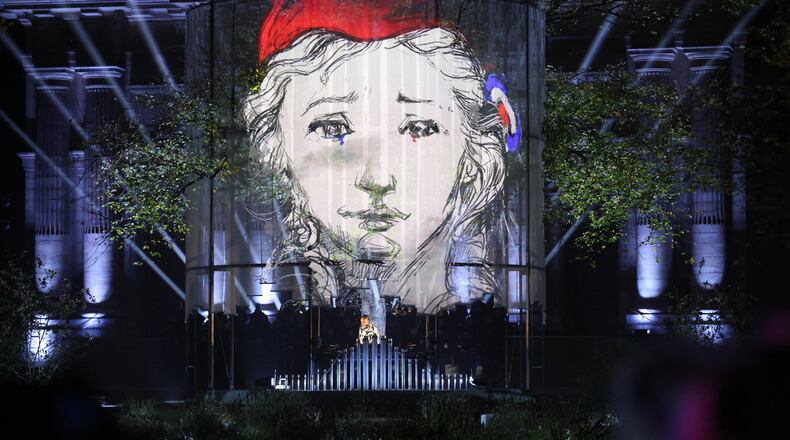 A DJ performs at the "Jardin du 13 novembre 2015" inaugurated Thursday Nov. 13, 2025 in Paris as part of ceremonies marking the 10th anniversary of terrorist attacks that killed 132 people and injured hundreds. (Ludovic Marin, Pool photo via AP)