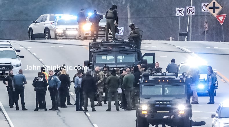 SWAT officers and GBI agents were on the scene Monday morning while a manhunt for a shooting suspect was underway along U.S. 78 in Snellville.