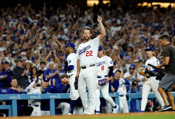 Los Angeles Dodgers pitcher Clayton Kershaw (22) tips his cap after striking out Chicago White Sox's Vinny Capra during the sixth inning for his 3,000th career strikeout Wednesday, July 2, 2025, in Los Angeles. (AP Photo/Kevork Djansezian)