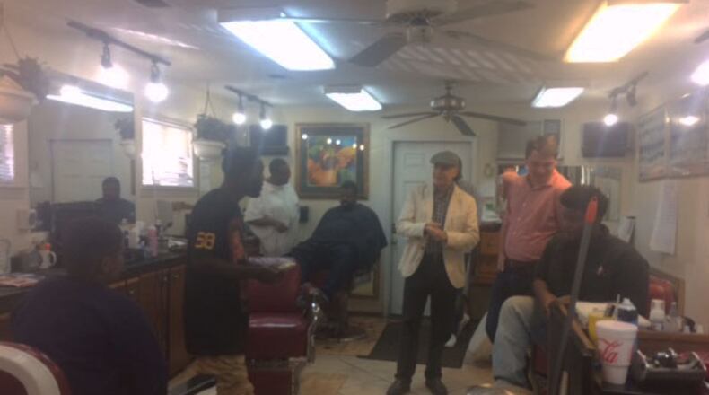 U.S. Senate candidate Jim Barksdale meets with patrons at Holmes Barber Shop in Savannah on Nov. 5, 2016. Tamar Hallerman/AJC.