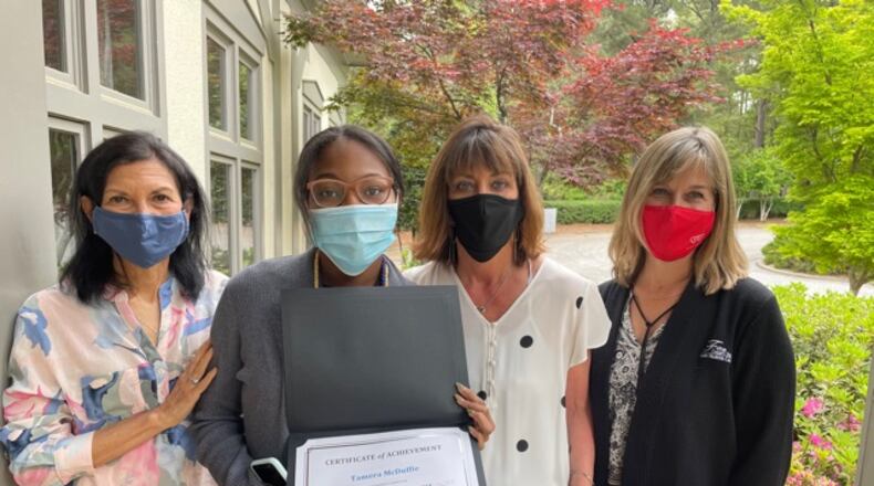 Tamera McDuffie accepts her graduation certificate from the Leadership Johns Creek team April 16, 2021. (Courtesy Leadership Johns Creek)