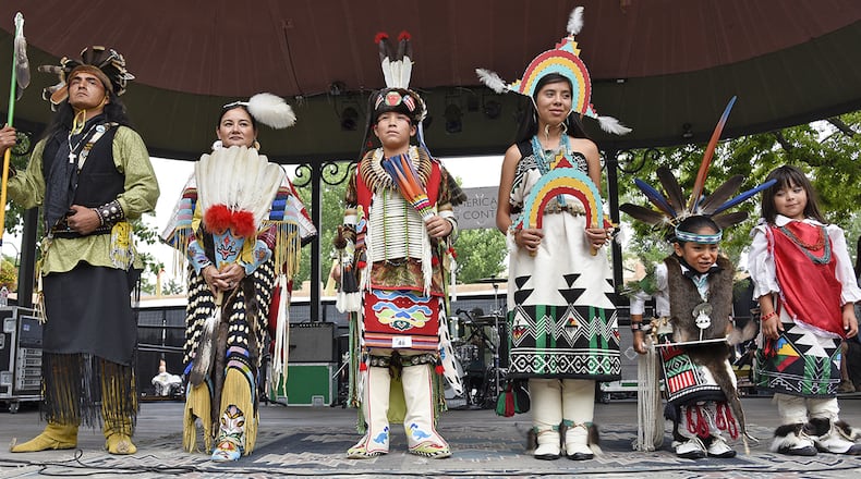 This Aug. 23, 2015, photo shows Male and Female Adult, Youth and Child category winners in the 2015 Santa Fe Indian Market Fashion Challenge of the Native American Clothing Contest at the Santa Fe Indian Market in Santa Fe., N.M. For nearly a century, American Indian jewelers, potters and other artists have been gathering in the heart of northern New Mexico to show off their creations at one of the nation's most prestigious art markets. The annual Santa Fe Indian Market begins Saturday, Aug. 19, 2017. (Phil Karshis/Courtesy of SWAIA/Santa Fe Indian Market via AP)